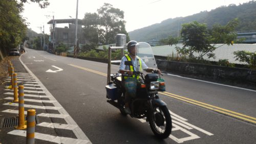Scooter rider on Taiwanese country road